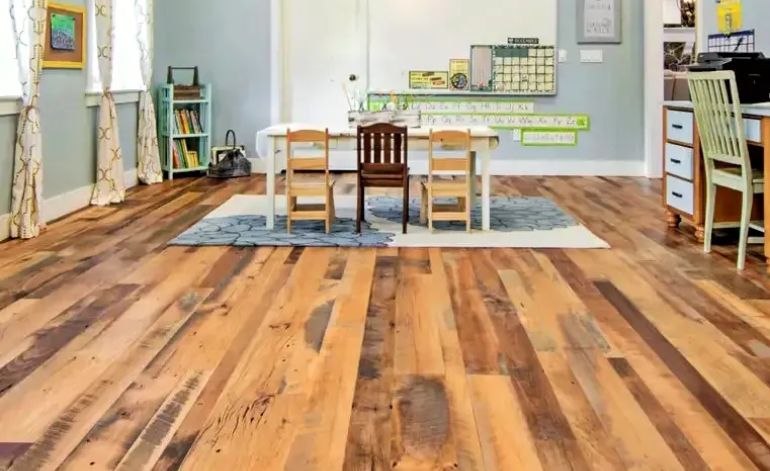 Interior view of a room with wooden floors and a desk, highlighting hardwood tile flooring service in Miami, FL.